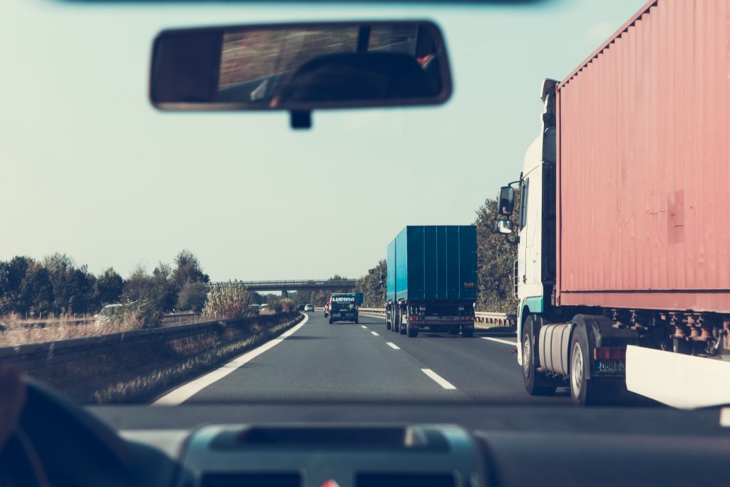 Car overtaking trucks